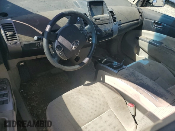 2006 Toyota Prius z VIN JTDKB20U167517552, wystawiony jako Copart lot #59218575 z przebiegiem Nie podano mil oraz Szkoda całkowita • Salvage title. Historia ofert i sprzedaży dostępna na DreamBid. Obrazek 8.