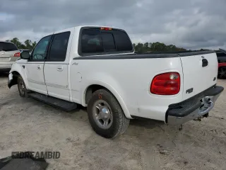 2001 Ford F-150 XLT with VIN 1FTRW07L01KC60815, listed as a Copart auction lot 87022424 with 205,304 mi miles and Salvage title. Bid and sale history available at DreamBid. Image 2.