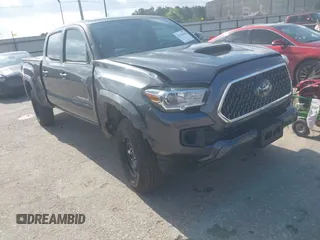 2018 Toyota Tacoma SR5 with VIN 3TMDZ5BN0JM051283, listed as a IAAI auction lot 42438690 with 106,155 mi miles and . Bid and sale history available at DreamBid. Image 6.