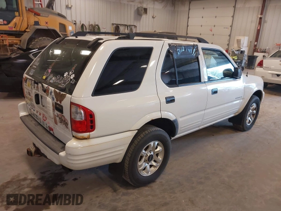 2004 Isuzu Rodeo S with VIN 4S2CK58W244313115, listed as a IAAI auction lot 42147475 with 186,594 mi miles and . Bid and sale history available at DreamBid. Image 4.