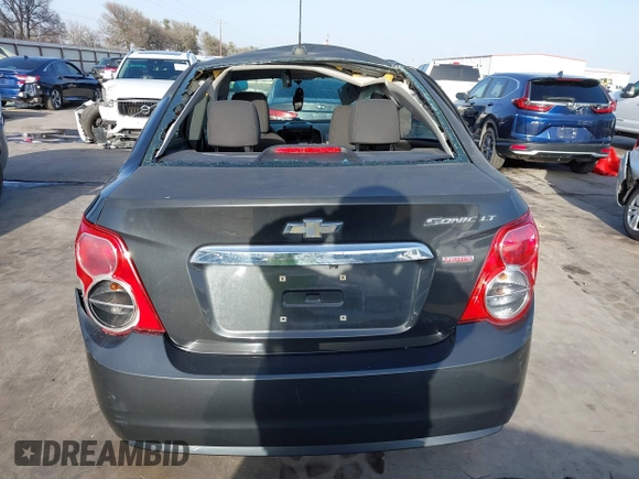 2015 Chevrolet Sonic LT z VIN 1G1JC5SB1F4128426, wystawiony jako IAAI lot #41739238 z przebiegiem 121 717 mil mil oraz . Historia ofert i sprzedaży dostępna na DreamBid. Obrazek 17.
