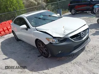 2015 Mazda 6 i Grand Touring with VIN JM1GJ1W50F1204322, listed as a IAAI auction lot 40694216 with 141,357 mi miles. Bid and sale history available at carsss.com. Image 1.