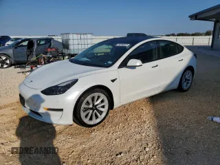 2022 Tesla Model 3 with VIN 5YJ3E1EA7NF184741, listed as a Copart auction lot 82487494 with 133,215 mi miles and Clean Title. Bid and sale history available at DreamBid. Image 1.