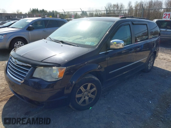 2010 Chrysler Town & Country Touring with VIN 2A4RR5DX5AR360173, listed as a IAAI auction lot 42082140 with 133,366 mi miles. Bid and sale history available at carsss.com. Image 2.