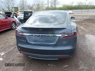 2015 Tesla Model S 85D with VIN 5YJSA1E21FF116775, listed as a IAAI auction lot 41876772 with 128,805 mi miles. Bid and sale history available at carsss.com. Image 17.