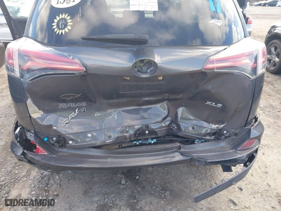 2018 Toyota RAV4 XLE with VIN 2T3WFREV2JW509988, listed as a IAAI auction lot 41729250 with 96,135 mi miles. Bid and sale history available at carsss.com. Image 6.