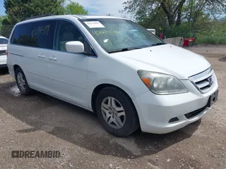 2007 Honda Odyssey EX-L z VIN 5FNRL38727B136000, wystawiony jako IAAI lot #42274594 z przebiegiem 245 438 mil mil oraz . Historia ofert i sprzedaży dostępna na DreamBid. Obrazek 1.
