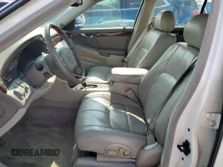 2003 Cadillac DeVille DTS z VIN 1G6KF57933U147843, wystawiony jako Copart lot #55875195 z przebiegiem 160 814 mil mil oraz Szkody całkowita. Historia ofert i sprzedaży dostępna na DreamBid. Obrazek 7.