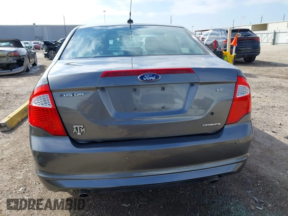 2012 Ford Fusion SE z VIN 3FAHP0HG0CR436745, wystawiony jako IAAI lot #41598812 z przebiegiem 116 305 mil mil oraz . Historia ofert i sprzedaży dostępna na DreamBid. Obrazek 17.