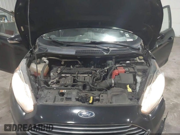2016 Ford Fiesta SE z VIN 3FADP4BJ5GM151066, wystawiony jako IAAI lot #42200928 z przebiegiem 105 004 mil mil oraz . Historia ofert i sprzedaży dostępna na DreamBid. Obrazek 10.