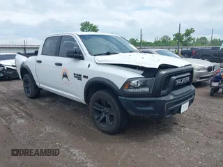 2021 Ram 1500 Warlock z VIN 1C6RR7LT6MS516828, wystawiony jako IAAI lot #42128048 z przebiegiem 63 781 mil mil oraz . Historia ofert i sprzedaży dostępna na DreamBid. Obrazek 1.