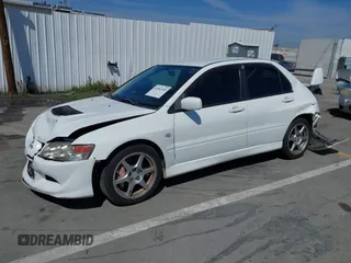 2005 Mitsubishi Lancer Evolution VIII with VIN JA3AH86DX5U054278, listed as a IAAI auction lot 41881180 with 157,497 mi miles. Bid and sale history available at carsss.com. Image 2.