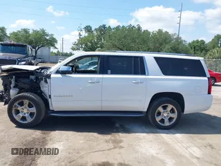 2020 Chevrolet Suburban Premier with VIN 1GNSCJKC9LR125292, listed as a IAAI auction lot 42073858 with 92,363 mi miles and . Bid and sale history available at DreamBid. Image 14.