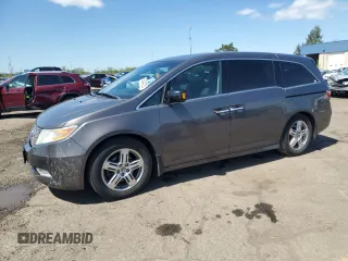 2012 Honda Odyssey Touring with VIN 5FNRL5H90CB093963, listed as a Copart auction lot 55434725 with 202,867 mi miles and Salvage Title. Bid and sale history available at DreamBid. Image 1.