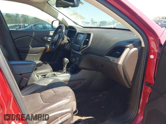 2015 Jeep Cherokee Trailhawk with VIN 1C4PJMBS1FW640483, listed as a IAAI auction lot 41883688 with 103,589 mi miles. Bid and sale history available at carsss.com. Image 5.