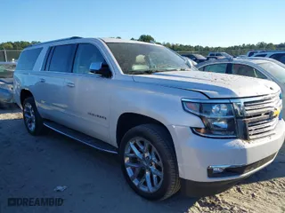 2019 Chevrolet Suburban Premier with VIN 1GNSCJKC0KR293658, listed as a IAAI auction lot 40563834 with 153,619 mi miles. Bid and sale history available at carsss.com. Image 1.