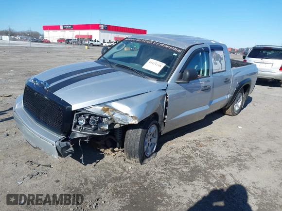 2006 Dodge Dakota SLT with VIN 1D7HE48N76S640351, listed as a IAAI auction lot 41121248 with 155,463 mi miles and . Bid and sale history available at DreamBid. Image 2.