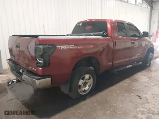 2010 Toyota Tundra 4WD Truck with VIN 5TFUW5F1XAX144077, listed as a IAAI auction lot 40135939 with 152,828 mi miles. Bid and sale history available at carsss.com. Image 4.