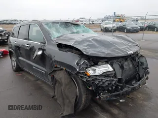 2015 Jeep Grand Cherokee Overland with VIN 1C4RJFCG3FC665854, listed as a IAAI auction lot 41697999 with 206,618 mi miles and . Bid and sale history available at DreamBid. Image 1.