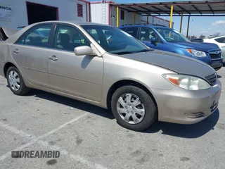 2004 Toyota Camry LE with VIN JTDBE32K840272070, listed as a IAAI auction lot 41970258 with 135,855 mi miles. Bid and sale history available at carsss.com. Image 1.
