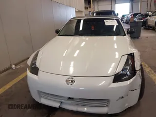 2005 Nissan 350Z Touring with VIN JN1AZ36A45M754923, listed as a IAAI auction lot 41720671 with 124,916 mi miles. Bid and sale history available at carsss.com. Image 12.