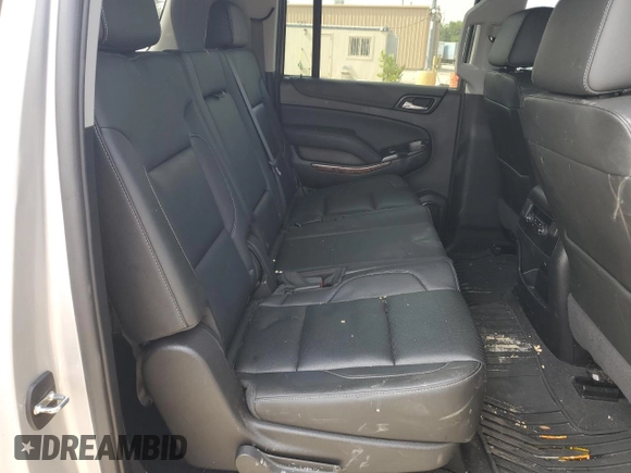 2020 Chevrolet Suburban Premier z VIN 1GNSKJKC0LR164243, wystawiony jako Copart lot #70530624 z przebiegiem Nie podano mil oraz Szkoda całkowita • Salvage title. Historia ofert i sprzedaży dostępna na DreamBid. Obrazek 10.