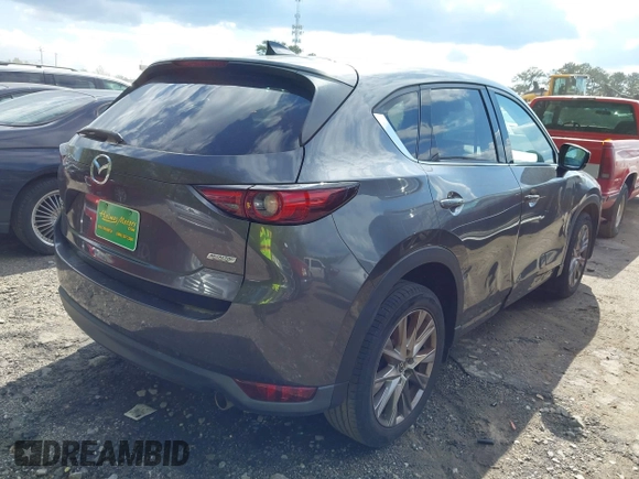 2019 Mazda CX-5 Grand Touring with VIN JM3KFBDM7K0619379, listed as a IAAI auction lot 42007107 with 209,590 mi miles. Bid and sale history available at carsss.com. Image 4.