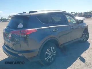 2018 Toyota RAV4 LE with VIN JTMZFREV7JJ207270, listed as a IAAI auction lot 41853828 with 89,179 mi miles. Bid and sale history available at carsss.com. Image 4.
