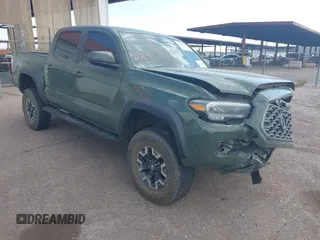 2021 Toyota Tacoma SR z VIN 3TYCZ5AN2MT049069, wystawiony jako IAAI lot #42116964 z przebiegiem 96 275 mil mil oraz . Historia ofert i sprzedaży dostępna na DreamBid. Obrazek 1.