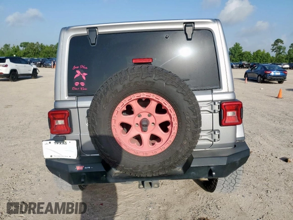 2021 Jeep Wrangler Unlimited Rubicon with VIN 1C4HJXFG0MW616829, listed as a Copart auction lot 61041425 with 128,724 mi miles and Salvage title. Bid and sale history available at DreamBid. Image 6.