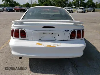 1996 Ford Mustang with VIN 1FALP4041TF206244, listed as a Copart auction lot 56311934 with 123,572 mi miles and Salvage Title. Bid and sale history available at carsss.com. Image 6.