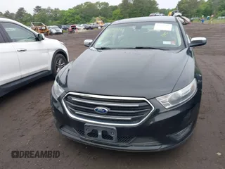 2014 Ford Taurus Limited z VIN 1FAHP2J8XEG112310, wystawiony jako IAAI lot #42367397 z przebiegiem 77 329 mil mil oraz . Historia ofert i sprzedaży dostępna na DreamBid. Obrazek 12.