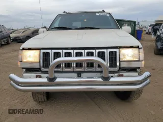 1998 Jeep Grand Cherokee Limited with VIN 1J4GZ88Z4WC164505, listed as a Copart auction lot 76843304 with 0 mi miles and Salvage Title. Bid and sale history available at carsss.com. Image 5.