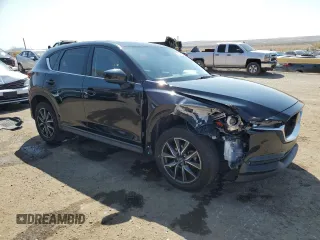 2018 Mazda CX-5 Grand Touring with VIN JM3KFADM9J1336792, listed as a Copart auction lot 52209435 with 107,852 mi miles and Salvage Title. Bid and sale history available at DreamBid. Image 4.