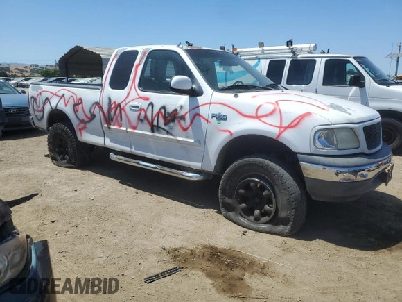 1999 Ford F-150 with VIN 1FTZX1727XKA70271, listed as a Copart auction lot 58016095 with 219,093 mi miles and Salvage title. Bid and sale history available at DreamBid. Image 4.