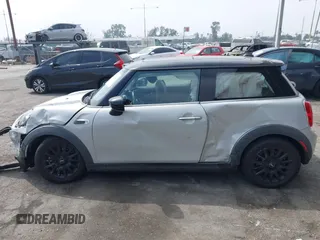 2021 MINI Hardtop Cooper with VIN WMWXR3C09M2N96671, listed as a IAAI auction lot 42031023 with 12,450 mi miles and . Bid and sale history available at DreamBid. Image 14.