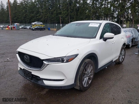 2021 Mazda CX-5 Grand Touring with VIN JM3KFBDM2M0357788, listed as a IAAI auction lot 41970254 with 56,153 mi miles. Bid and sale history available at carsss.com. Image 2.