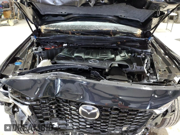 2025 Mazda CX-90 Select z VIN JM3KKAHD1S1201605, wystawiony jako Copart lot #58155135 z przebiegiem Nie podano mil oraz Szkody całkowita. Historia ofert i sprzedaży dostępna na DreamBid. Obrazek 12.