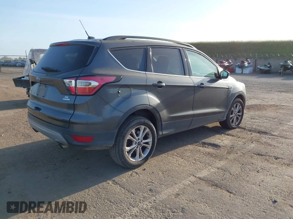 2017 Ford Escape SE with VIN 1FMCU0GD1HUE75697, listed as a IAAI auction lot 42077385 with 160,634 mi miles and . Bid and sale history available at DreamBid. Image 4.