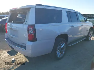2019 Chevrolet Suburban Premier with VIN 1GNSCJKC0KR293658, listed as a IAAI auction lot 40563834 with 153,619 mi miles. Bid and sale history available at carsss.com. Image 4.