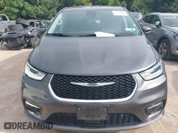 2023 Chrysler Pacifica Touring L with VIN 2C4RC1BG8PR594481, listed as a IAAI auction lot 42618839 with 60,748 mi miles and . Bid and sale history available at DreamBid. Image 6.