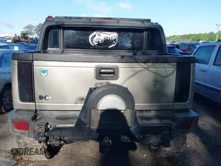 2005 Hummer H2 SUT with VIN 5GRGN22UX5H106653, listed as a IAAI auction lot 42015559 with 180,519 mi miles. Bid and sale history available at carsss.com. Image 16.