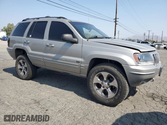 2001 Jeep Grand Cherokee Limited with VIN 1J4GW58N11C721108, listed as a Copart auction lot 60176915 with 257,907 mi miles and Salvage title. Bid and sale history available at DreamBid. Image 4.