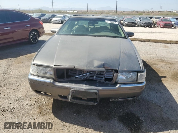 1998 Cadillac Eldorado z VIN 1G6EL12YXWU610918, wystawiony jako Copart lot #57309075 z przebiegiem 168 228 mil mil oraz Szkoda całkowita • Salvage title. Historia ofert i sprzedaży dostępna na DreamBid. Obrazek 5.