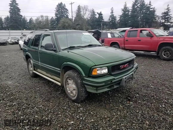 1997 GMC Jimmy SLS with VIN 1GKDT13WXV2563104, listed as a Copart auction lot 86317834 with 121,791 mi miles and Salvage Title. Bid and sale history available at carsss.com. Image 11.