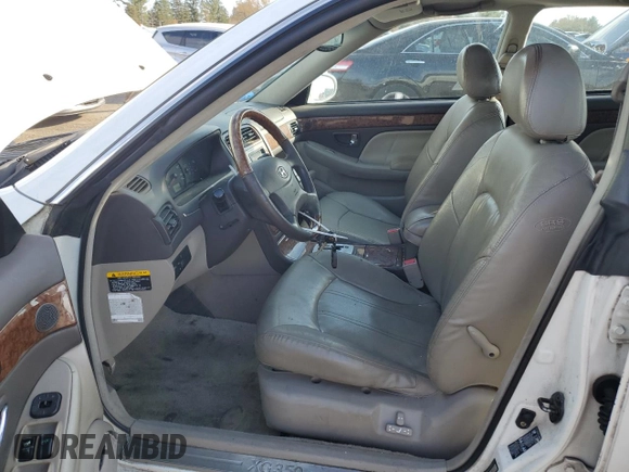 2005 Hyundai XG z VIN KMHFU45E85A392619, wystawiony jako Copart lot #78087664 z przebiegiem 71 256 mil mil oraz Szkody całkowita. Historia ofert i sprzedaży dostępna na DreamBid. Obrazek 7.