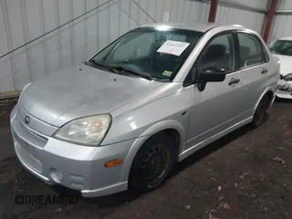 2003 Suzuki Aerio S z VIN JS2RA41S335159927, wystawiony jako IAAI lot #42012847 z przebiegiem 132 482 mil mil oraz . Historia ofert i sprzedaży dostępna na DreamBid. Obrazek 2.