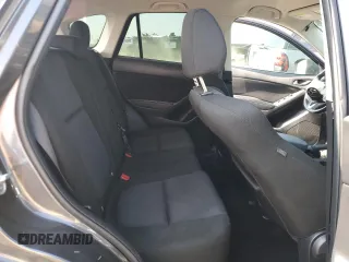 2014 Mazda CX-5 Sport z VIN JM3KE4BE1E0359446, wystawiony jako Copart lot #54562545 z przebiegiem 128 150 mil mil oraz Szkoda całkowita • Salvage title. Historia ofert i sprzedaży dostępna na DreamBid. Obrazek 11.