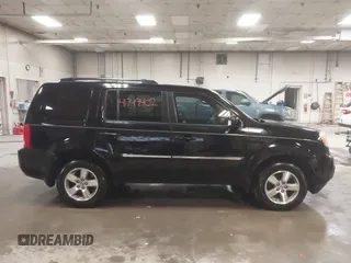 2012 Honda Pilot Touring with VIN 5FNYF4H91CB067014, listed as a IAAI auction lot 41749402 with 151,248 mi miles. Bid and sale history available at carsss.com. Image 13.