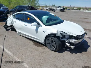 2018 Tesla Model 3 Long Range Battery with VIN 5YJ3E1EA3JF057527, listed as a IAAI auction lot 42072126 with 1 mi miles. Bid and sale history available at carsss.com. Image 1.